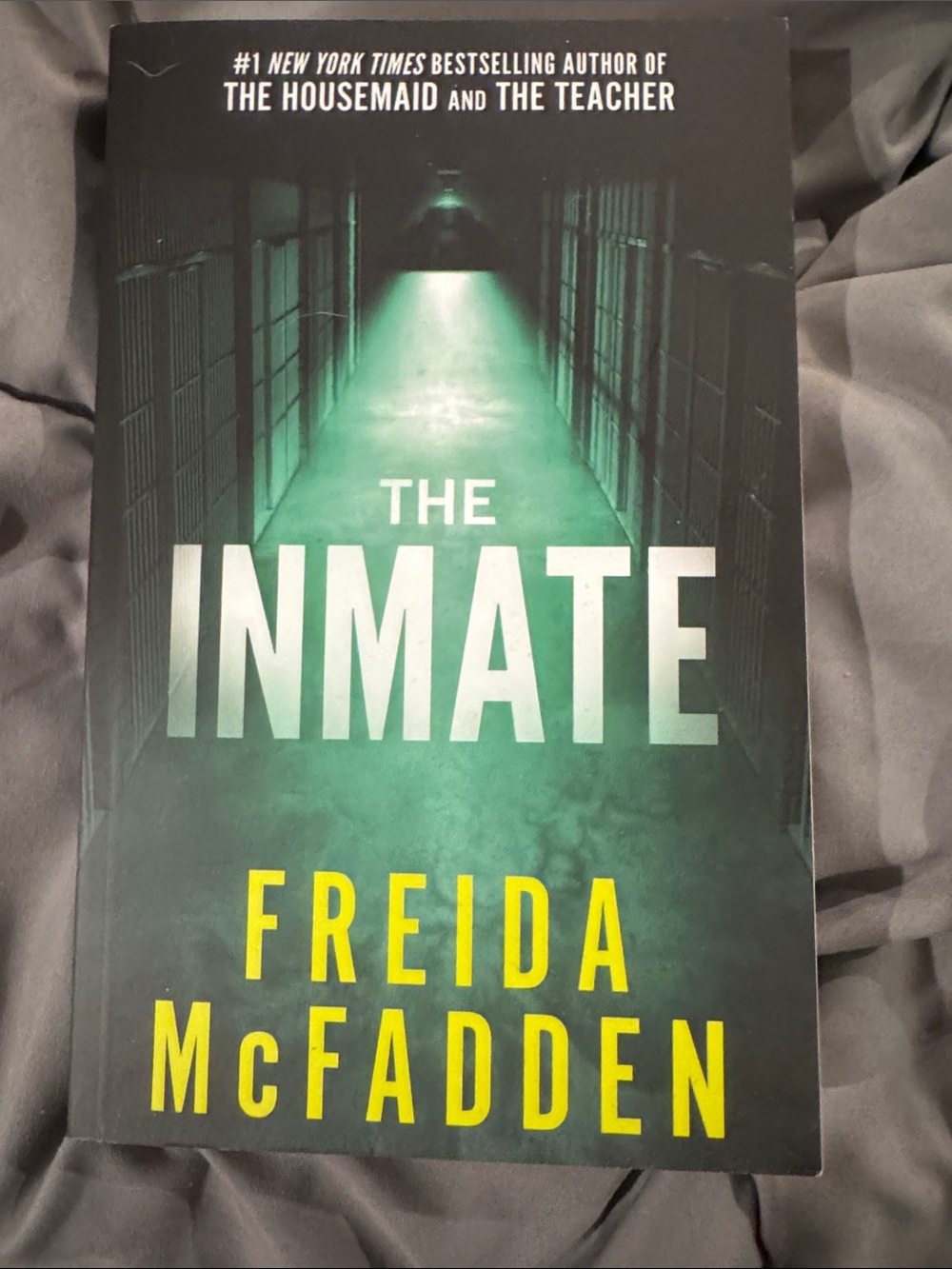 The Inmate by Freida McFadden - Green & Yellow Paperback Thriller